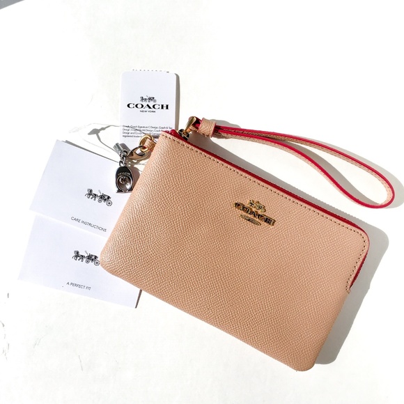 Coach Handbags - COACH Corner Zip Wristlet With Charms